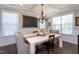 Formal dining room with a stylish chandelier, wainscoting, and hardwood floors at 3209 Star Gazing Ct, Wake Forest, NC 27587