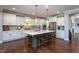The spacious kitchen has an island with seating, modern stainless-steel appliances, and ample counter space at 3209 Star Gazing Ct, Wake Forest, NC 27587
