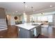 Kitchen island features modern fixtures and adjacent living spaces offer open-concept living at 3209 Star Gazing Ct, Wake Forest, NC 27587
