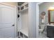 Well-organized mudroom with built-in shelving, seating, and convenient access to powder room at 3209 Star Gazing Ct, Wake Forest, NC 27587