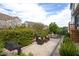 Inviting patio area featuring a cozy seating area, lush landscaping, and an outdoor dining space at 3209 Star Gazing Ct, Wake Forest, NC 27587