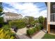 Inviting patio area featuring a cozy seating area, lush landscaping, and an outdoor dining space at 3209 Star Gazing Ct, Wake Forest, NC 27587