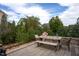 Charming patio with wood table and seating for outdoor dining at 3209 Star Gazing Ct, Wake Forest, NC 27587