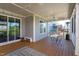 A screened in porch with outdoor furniture and nice views of the backyard at 3209 Star Gazing Ct, Wake Forest, NC 27587