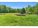Beautiful backyard with a well-manicured lawn and vibrant landscaping at 3214 Saddle Club Rd, Mebane, NC 27302