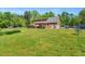 Spacious backyard with a gazebo and mature trees; perfect for outdoor living at 3214 Saddle Club Rd, Mebane, NC 27302