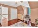 This Bedroom features a changing table, accent chair, hardwood floors, and a large closet at 3214 Saddle Club Rd, Mebane, NC 27302