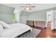 Bedroom with hardwood floors, large window, and neutral color scheme at 3214 Saddle Club Rd, Mebane, NC 27302