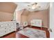 This Bedroom features a white crib, dresser, accent chair, and hardwood floors at 3214 Saddle Club Rd, Mebane, NC 27302