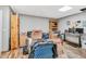 Cluttered bedroom with wood floors and multiple storage solutions at 3214 Saddle Club Rd, Mebane, NC 27302