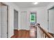 Second floor hallway featuring hardwood floors and natural light at 3214 Saddle Club Rd, Mebane, NC 27302