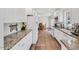 Spacious kitchen featuring granite countertops and white cabinetry at 3214 Saddle Club Rd, Mebane, NC 27302