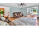 Comfortable living room with plush seating, soft rug, and view into playroom at 3214 Saddle Club Rd, Mebane, NC 27302