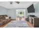 Inviting living room with a neutral palette and view into playroom area at 3214 Saddle Club Rd, Mebane, NC 27302
