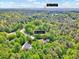 Aerial view of 3581 Boulder Ct, nestled within lush trees, conveniently close to Olde Liberty Golf Club at 3581 Boulder Ct, Wake Forest, NC 27587