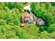 Aerial view of the home featuring a deck and surrounding lush greenery at 3581 Boulder Ct, Wake Forest, NC 27587