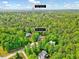 Overhead view of the property at 3581 Boulder Ct, set among lush trees, near Hasentree Golf Club at 3581 Boulder Ct, Wake Forest, NC 27587
