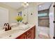 Bathroom vanity with double sinks, tiled wall and trim at 3581 Boulder Ct, Wake Forest, NC 27587