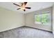 Neutral bedroom with a ceiling fan and view of the outdoors at 3581 Boulder Ct, Wake Forest, NC 27587