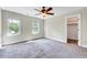 Bright bedroom with large windows, neutral paint, carpeted floor and closet at 3581 Boulder Ct, Wake Forest, NC 27587
