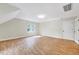 Bonus room with wood laminate flooring, window and white trim at 3581 Boulder Ct, Wake Forest, NC 27587