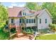 Exterior of home with back deck, gray siding, mature trees and landscape at 3581 Boulder Ct, Wake Forest, NC 27587