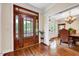 Inviting foyer with hardwood floors, a decorative front door, and views into the dining room at 3581 Boulder Ct, Wake Forest, NC 27587
