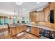 Spacious kitchen with granite countertops, stainless appliances, and hardwood floors at 3581 Boulder Ct, Wake Forest, NC 27587
