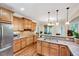 Bright kitchen with stainless steel appliances, granite countertops, and wood cabinets at 3581 Boulder Ct, Wake Forest, NC 27587