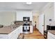 Bright kitchen features white cabinets and stainless steel appliances at 3581 Boulder Ct, Wake Forest, NC 27587