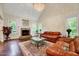 Bright living room with fireplace, hardwood floors, and large windows at 3581 Boulder Ct, Wake Forest, NC 27587