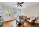 Cozy living room with hardwood floors, ceiling fan, and natural light at 3581 Boulder Ct, Wake Forest, NC 27587