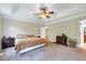 Large main bedroom featuring tray ceilings and neutral walls at 3581 Boulder Ct, Wake Forest, NC 27587