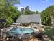 Aerial view of a home featuring a large backyard with a pool and surrounding greenery at 359 Heather Bluffs Dr, Garner, NC 27529