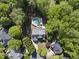 An aerial view of a home surrounded by lush greenery with a backyard pool at 359 Heather Bluffs Dr, Garner, NC 27529