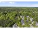 An aerial view of the tree-lined neighborhood, showing the lush landscaping surrounding single Gathering homes at 359 Heather Bluffs Dr, Garner, NC 27529