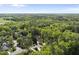 Aerial view of a lush green neighborhood with mature trees at 359 Heather Bluffs Dr, Garner, NC 27529