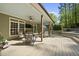 Wide angle shot of a covered back deck with a seating area and outdoor kitchen features at 359 Heather Bluffs Dr, Garner, NC 27529