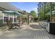 Large backyard deck featuring outdoor dining, a cozy hammock, and access to the inviting covered patio and pool at 359 Heather Bluffs Dr, Garner, NC 27529