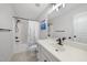 Bathroom featuring white tiled shower and tub combination, white vanity with modern fixtures, and neutral tones at 359 Heather Bluffs Dr, Garner, NC 27529
