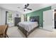 Bedroom with neutral walls, a ceiling fan, and abundant natural light, complemented by a comfortable bed at 359 Heather Bluffs Dr, Garner, NC 27529