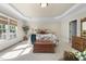 Spacious and bright bedroom with a sitting area near a large window at 359 Heather Bluffs Dr, Garner, NC 27529