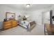 Cozy bedroom featuring a bed with a unique headboard, a dresser, and neutral-toned walls, creating a relaxing space at 359 Heather Bluffs Dr, Garner, NC 27529