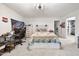 Neutral colored bedroom with rustic wood bedframe, attached desk, and ample storage space at 359 Heather Bluffs Dr, Garner, NC 27529