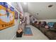 Bonus room decorated with sports memorabilia, plush seating, and a cozy atmosphere at 359 Heather Bluffs Dr, Garner, NC 27529