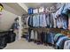 Walk-in closet with shelving, clothing rods, and ample storage space at 359 Heather Bluffs Dr, Garner, NC 27529