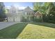 A two-story residence offering a three-car garage, complemented by a well-maintained lawn and landscaping at 359 Heather Bluffs Dr, Garner, NC 27529