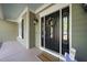 Welcoming front entrance with a decorated door and a 'welcome' mat at 359 Heather Bluffs Dr, Garner, NC 27529
