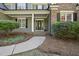 Charming home entry with neatly arranged landscaping and a welcoming front porch at 359 Heather Bluffs Dr, Garner, NC 27529