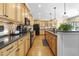 Traditional kitchen with wood cabinets, granite countertops, stainless steel appliances, and hardwood floors at 359 Heather Bluffs Dr, Garner, NC 27529